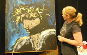 Stephanie Burke looks at one of her paintings of Christ