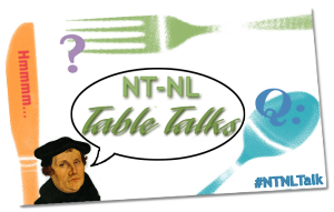 NT-NL Table Talks logo: white background, a knife, fork, and spoon frame the text "NT-NL Table Talks." On the bottom left corner is an image of Martin Luther and the bottom right corner shows the hashtag #NTNLTalk
