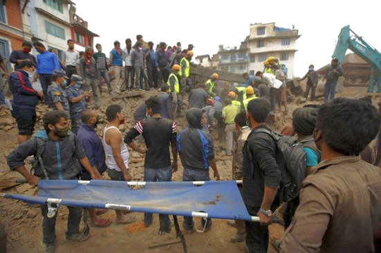 Image from REUTERS/Navesh Chitrakar, courtesy trust.org of workers in Nepal helping victims of the earhquake.